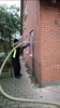 Professionel installation af hulmursisolering for bedre varmebesparelse i hjemmet.